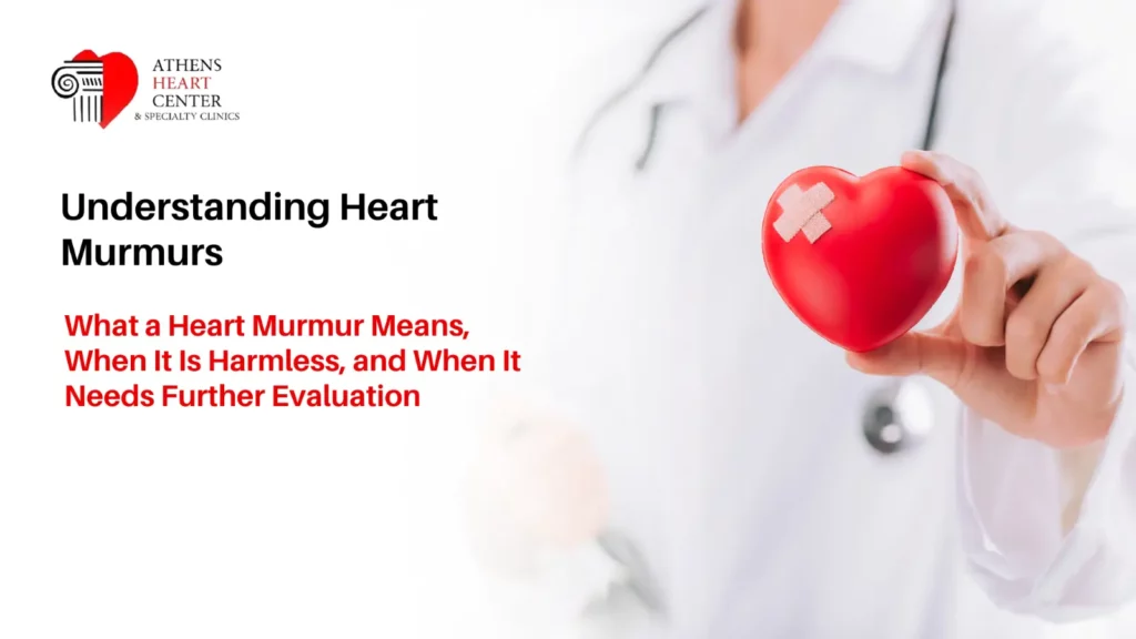 Athens Heart Center blog banner titled "Understanding Heart Murmurs" featuring a doctor in a lab coat holding a small red heart model with a bandage.