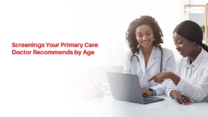Dr. Subodh Agrawal discussing age-appropriate preventive health screenings and a personalized care plan with a patient in an examination room.